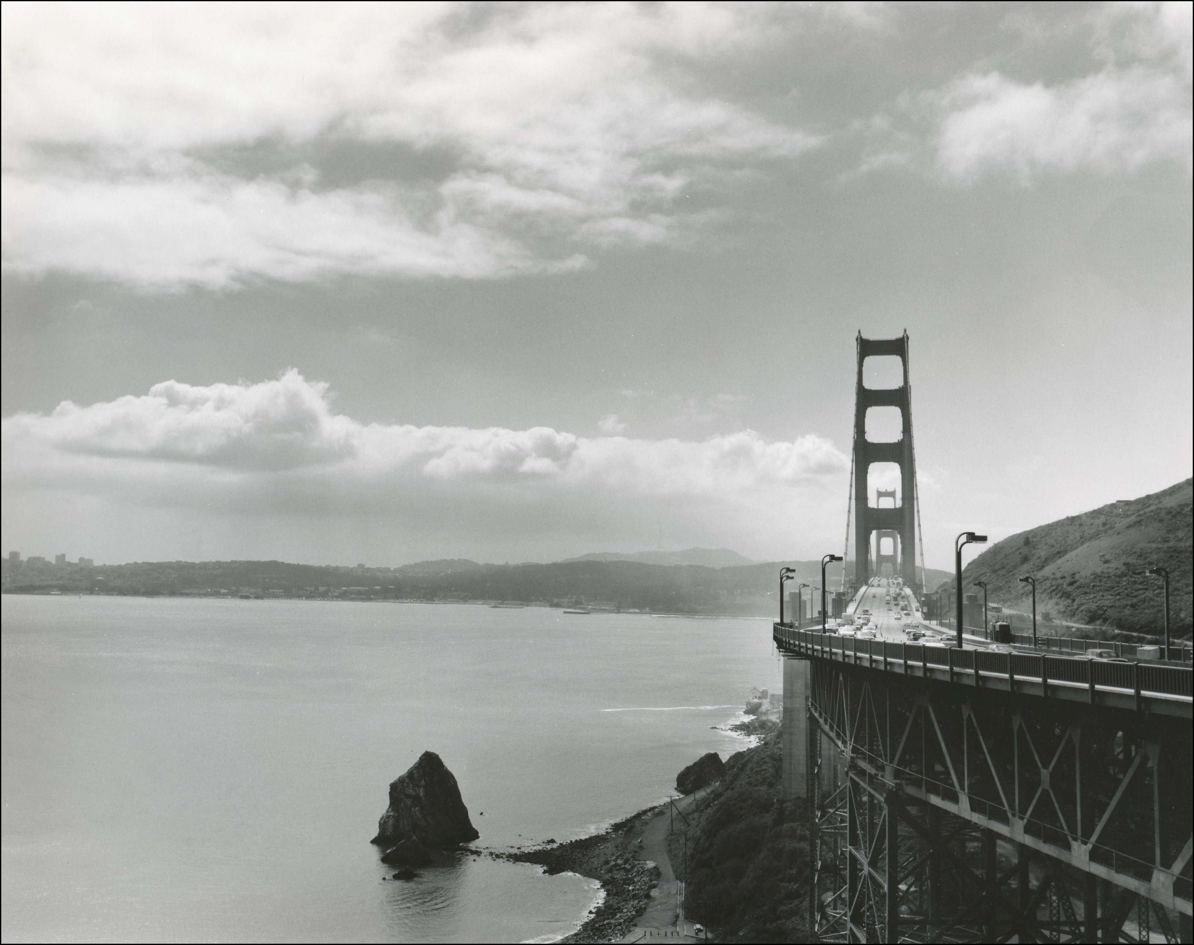 view of the Golden Gate bridge on the right side and San Francisco Bay